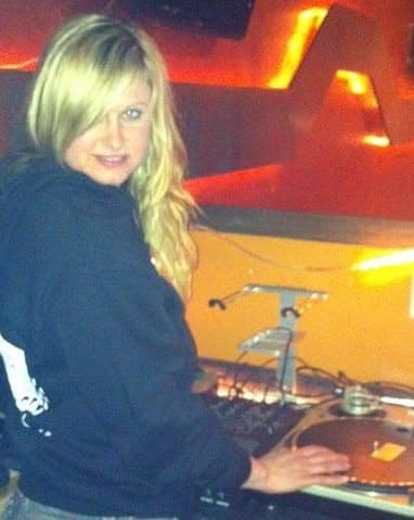 Andrea Dailey DJing behind a turntable