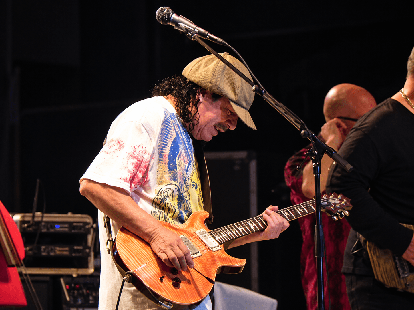 Carlos Santana playing guitar at Saturday in the Park