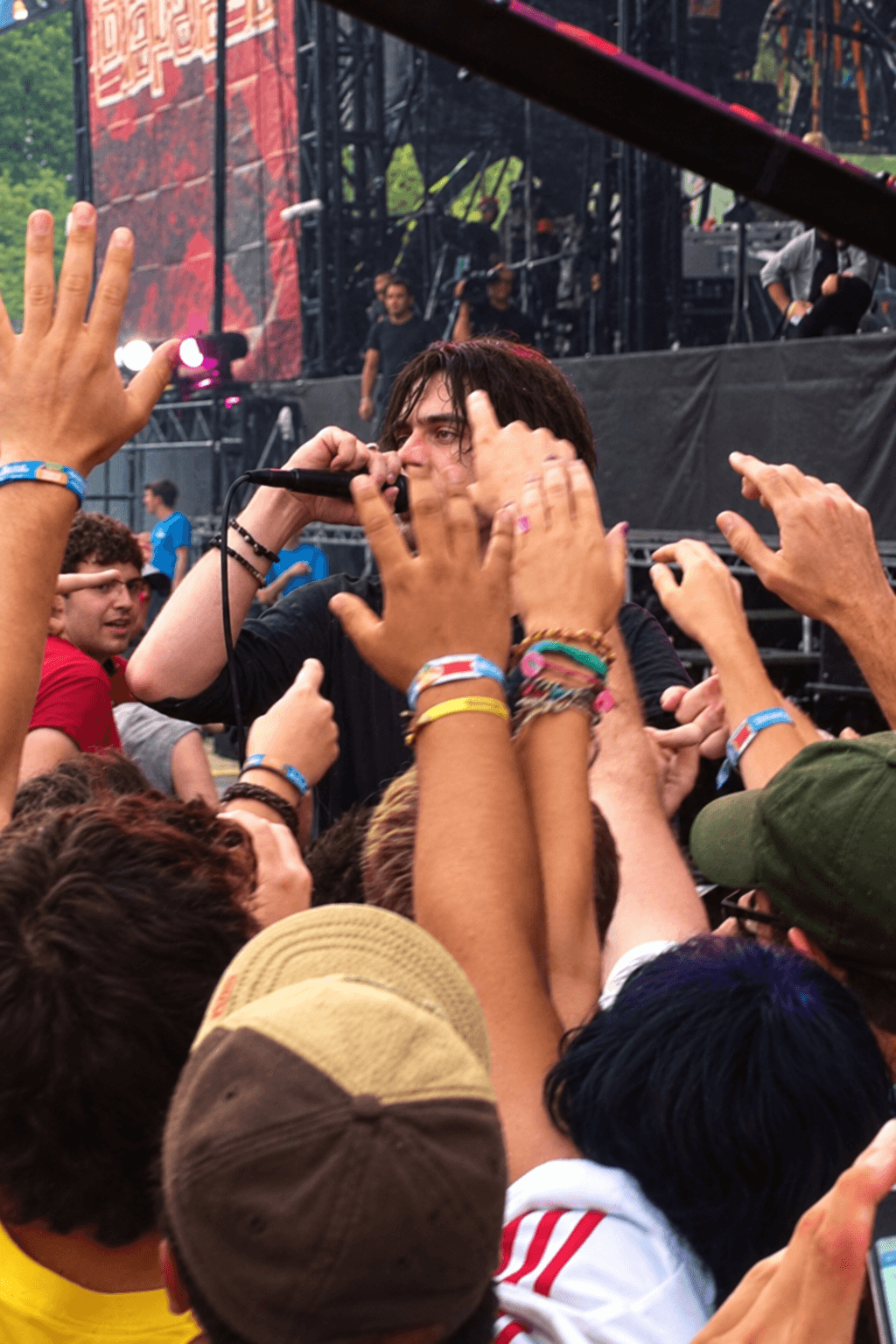 Conor Oberst of Bright Eyes singing among the crowd at Lollapalooza