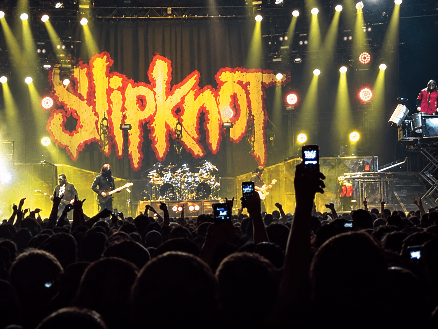 Slipknot performing in front of a large Slipknot stage backdrop