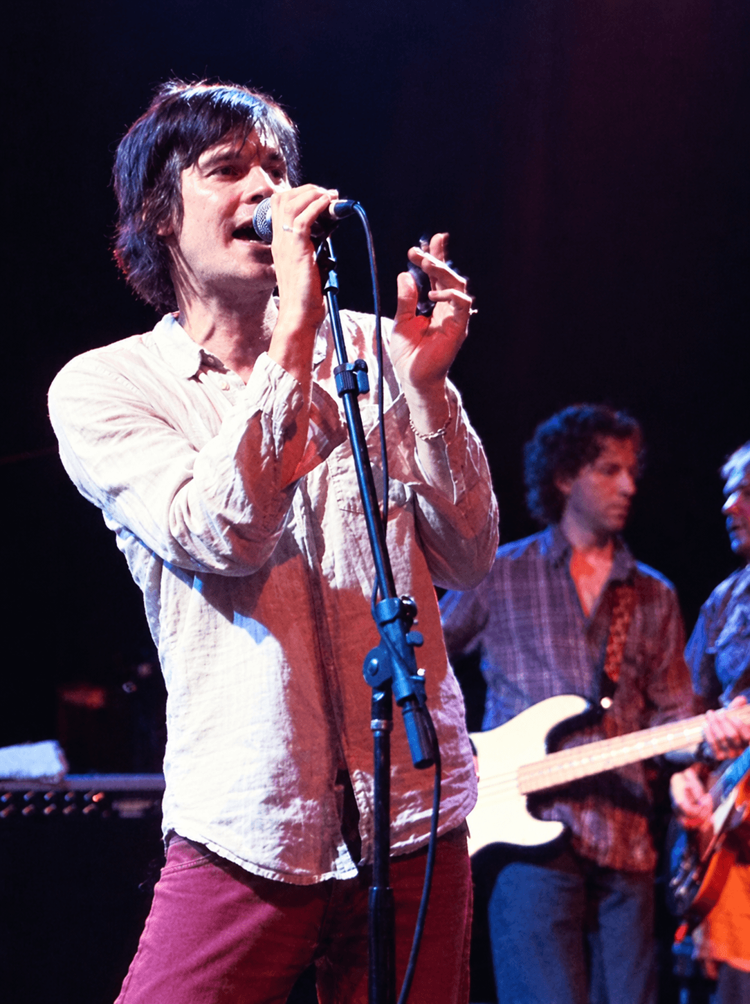 Tim Kasher of Cursive singing onstage
